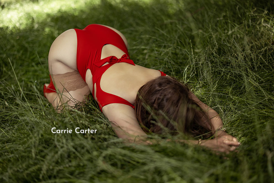 Carrie Carter playing around in the long grass of her London home.